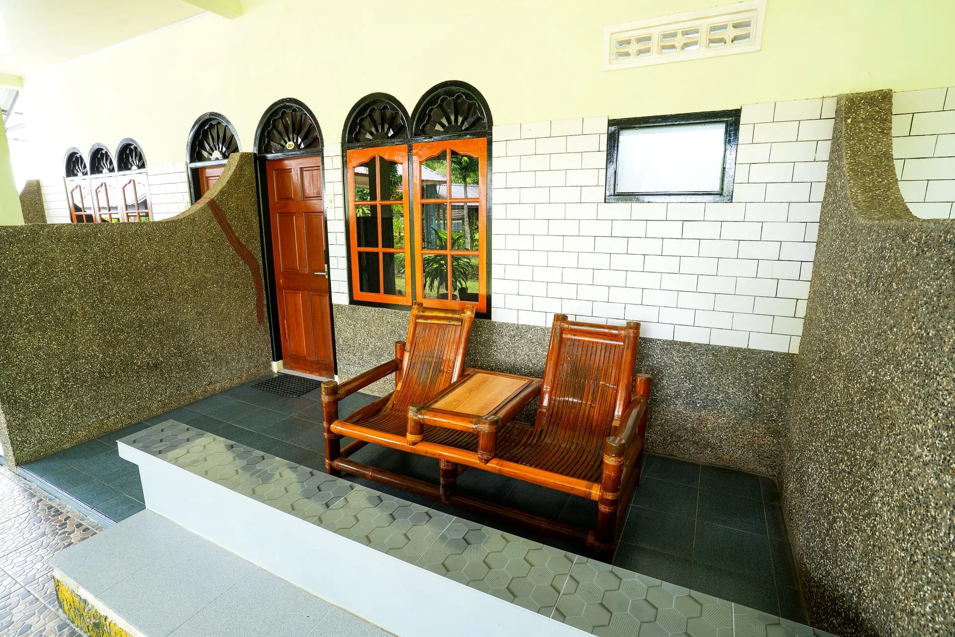 Terrace seating outside the rooms