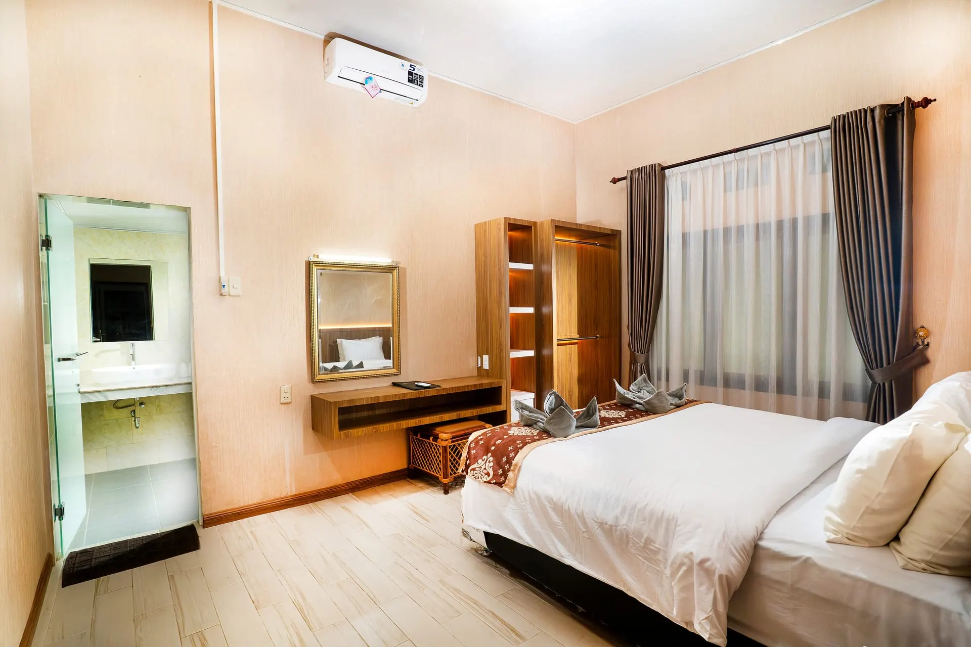 Deluxe Room vanity and bed
