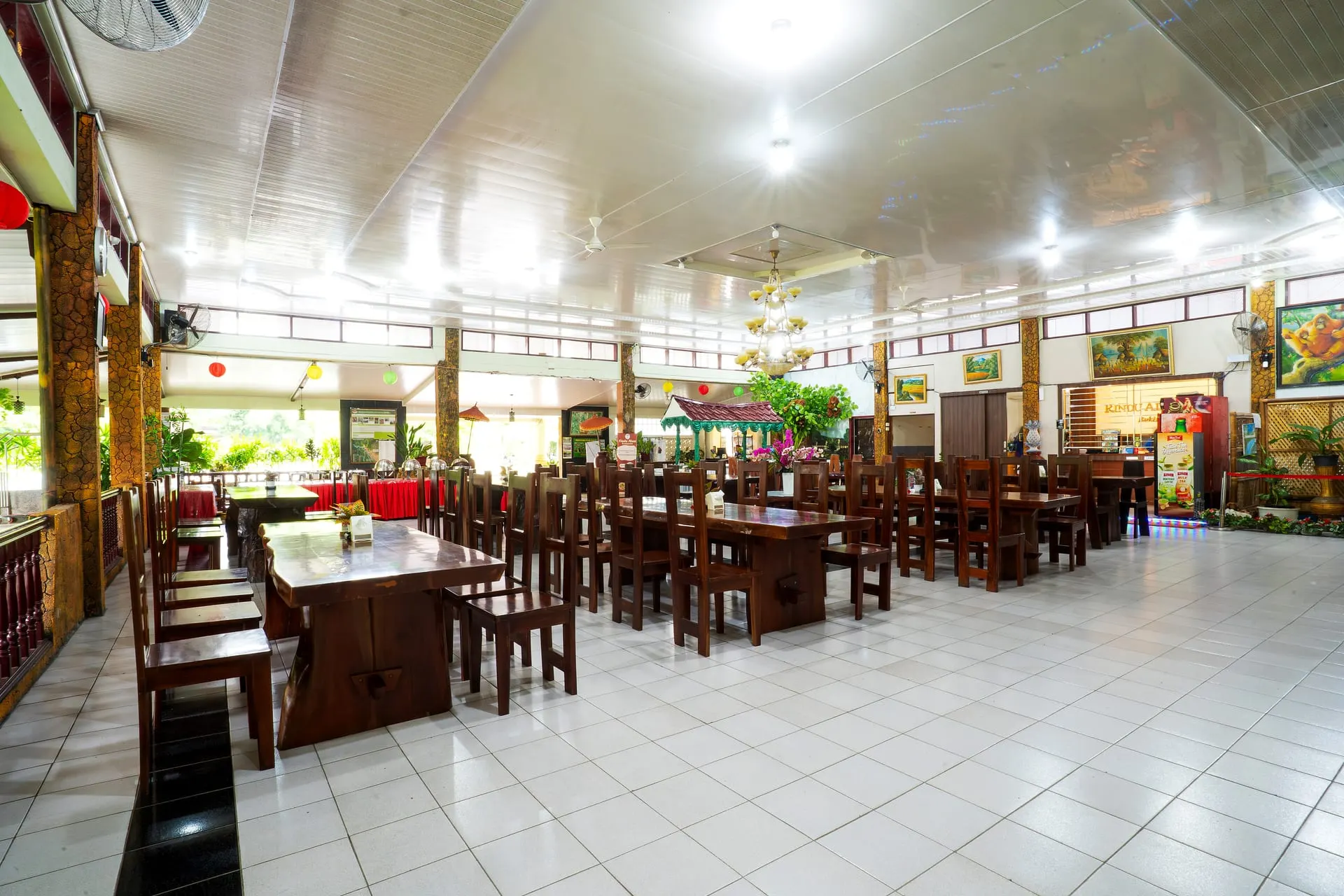 Restaurant dining hall with long wooden tables