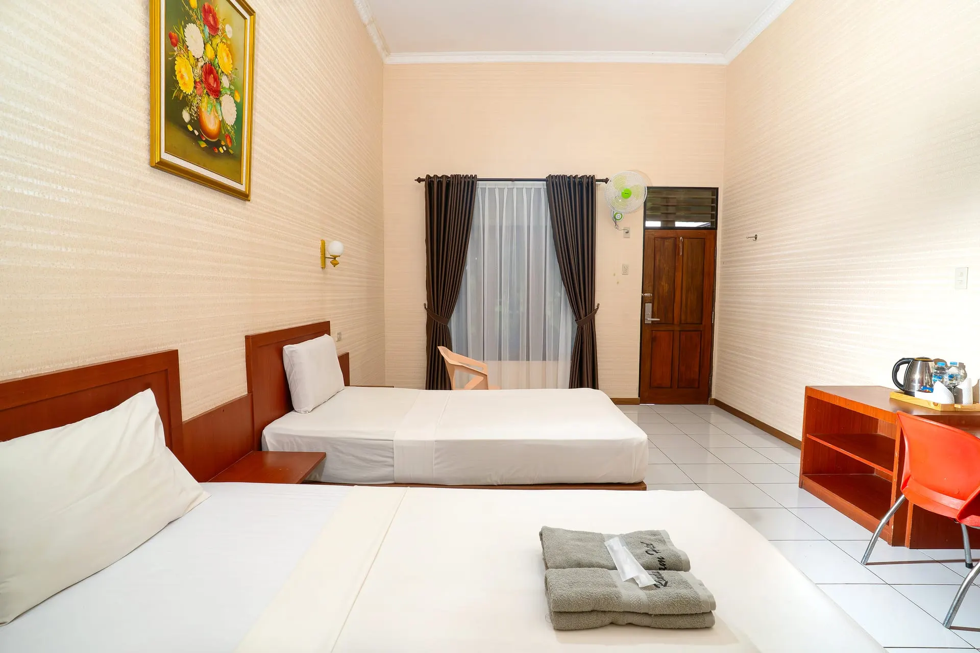 Standard Room bed with folded towels