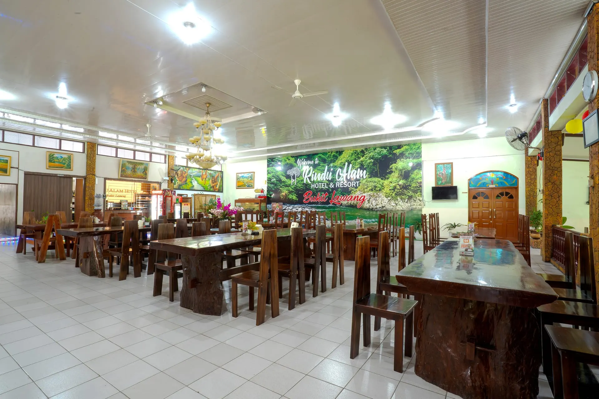 Indoor restaurant hall with wooden tables