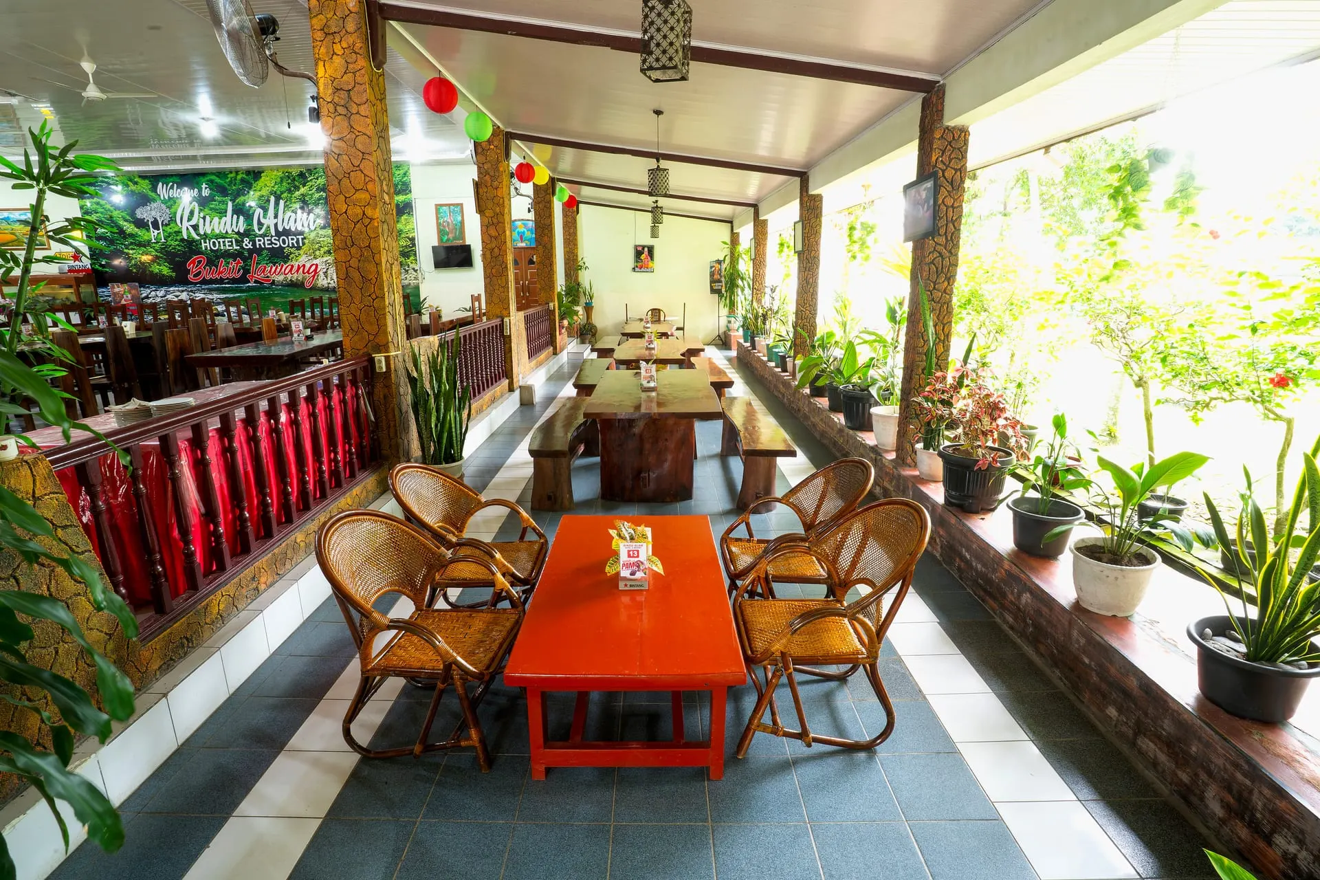 Open-air dining terrace with rattan chairs