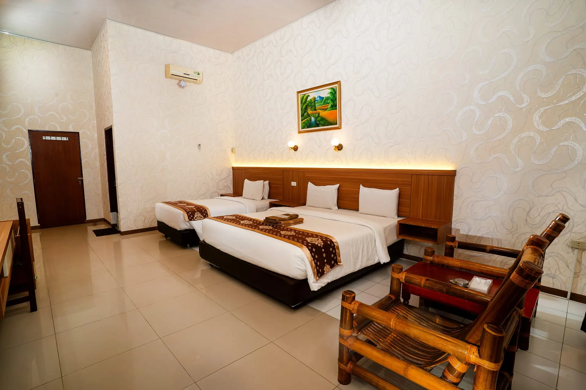 Superior Room with two beds and bamboo chairs